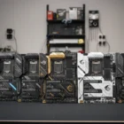 ATX Motherboards displayed in a row on a workbench.
